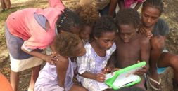 Children discovering laptops