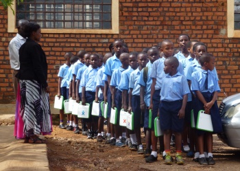 2017-11 Students carrying XOs in Rwanda.JPG